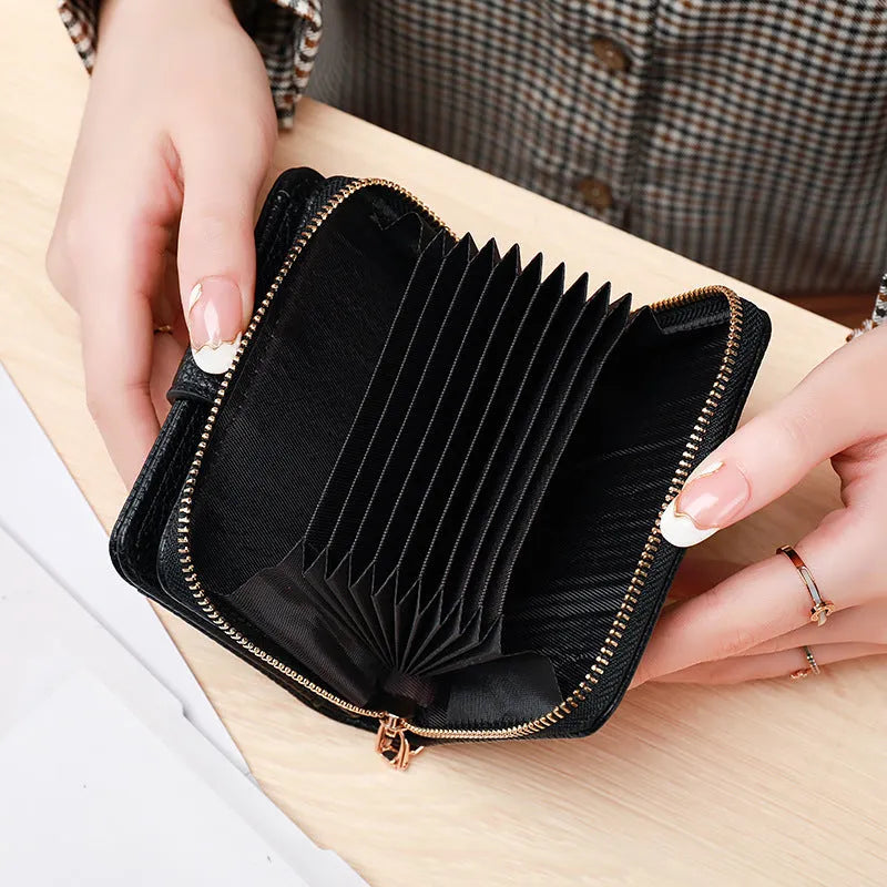 Women's short organ wallet with lychee pattern in pu leather, showing antibacterial lining and reinforced sewing thread detail