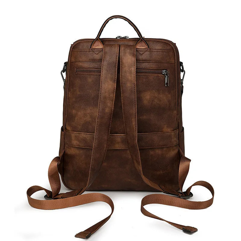 Solid colour retro college backpack with curved shoulder straps, shown in multiple colour options including black and blue.
