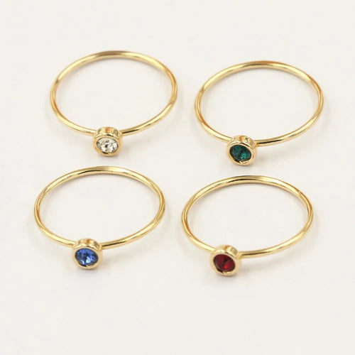 14K gold plated zircon knuckle ring on finger showing copper base with decorative stones