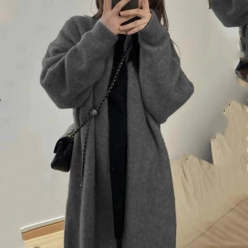 Women's loose knitted chenille cardigan in dark grey showing 3D pattern texture