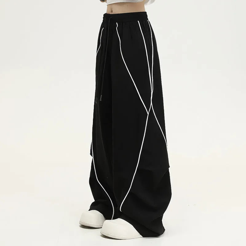 Black pleated wide-leg hip hop trousers with striped pattern and mid-waist design