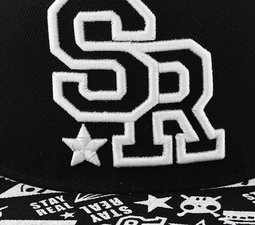 Cotton baseball cap with embroidered letters on the front, shown in black and white colours.