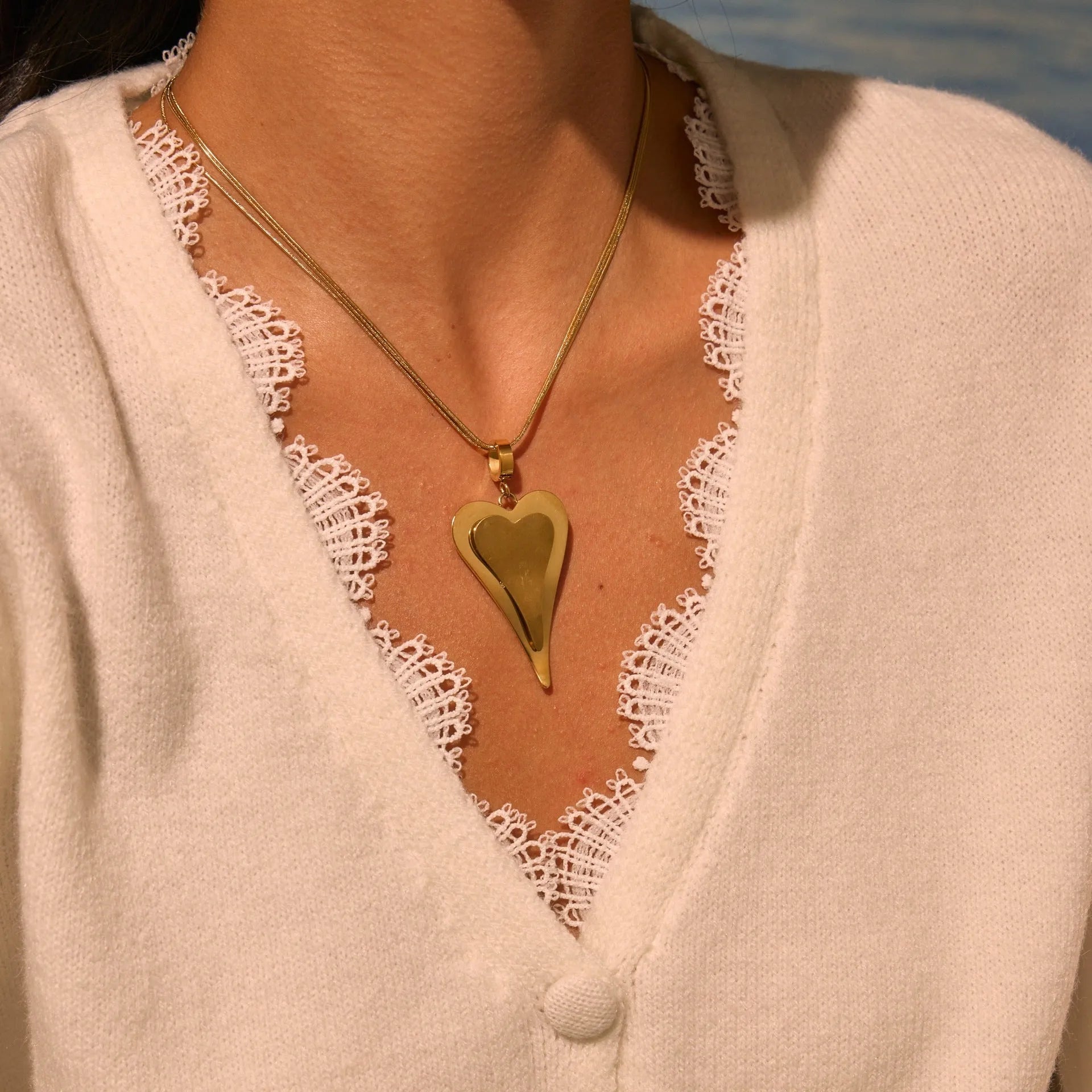 Stainless steel geometric necklace with double heart snake bones pendant in gold or steel colour options
