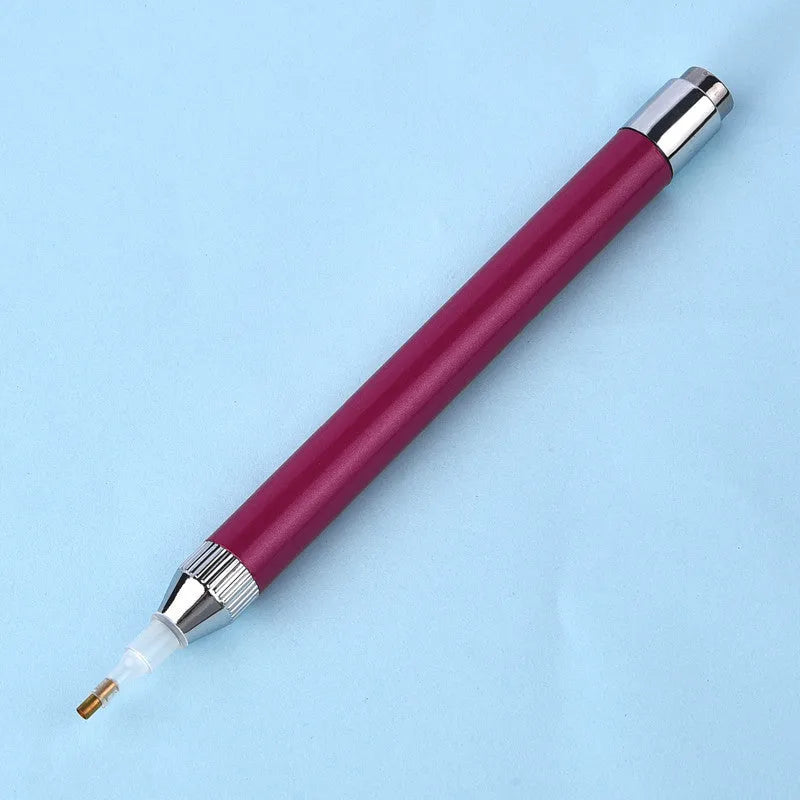 Aluminium alloy luminous drill pen for diamond painting in gold, red, or blue colour.