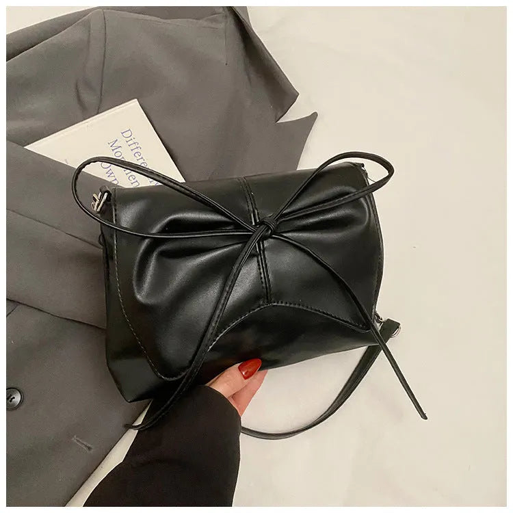 Women's black PU leather crossbody underarm bag with horizontal square shape and sewing line detail