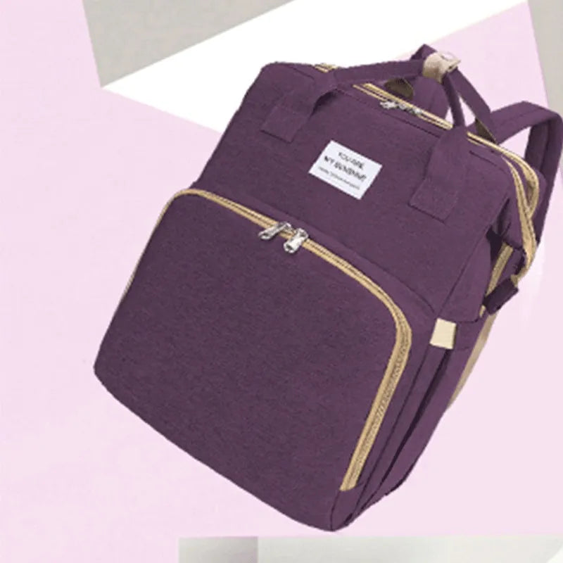 Portable folding mummy bag in multiple colours with curved shoulder strap and USB interface