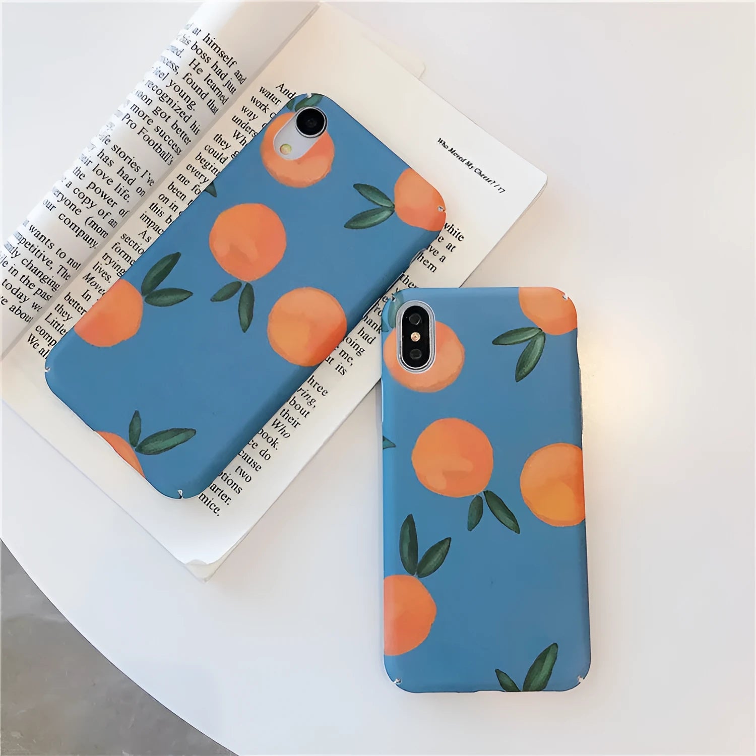 Orange plastic iPhone case with retro-style water and blue background design.