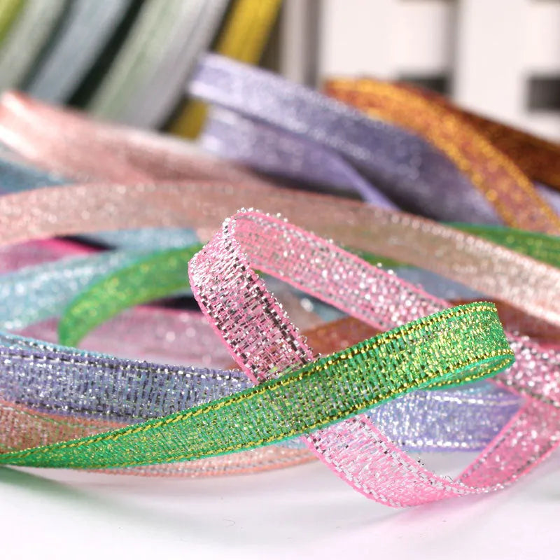 Roll of 0.6cm wide coloured polyester gift ribbon with 22 metre length.