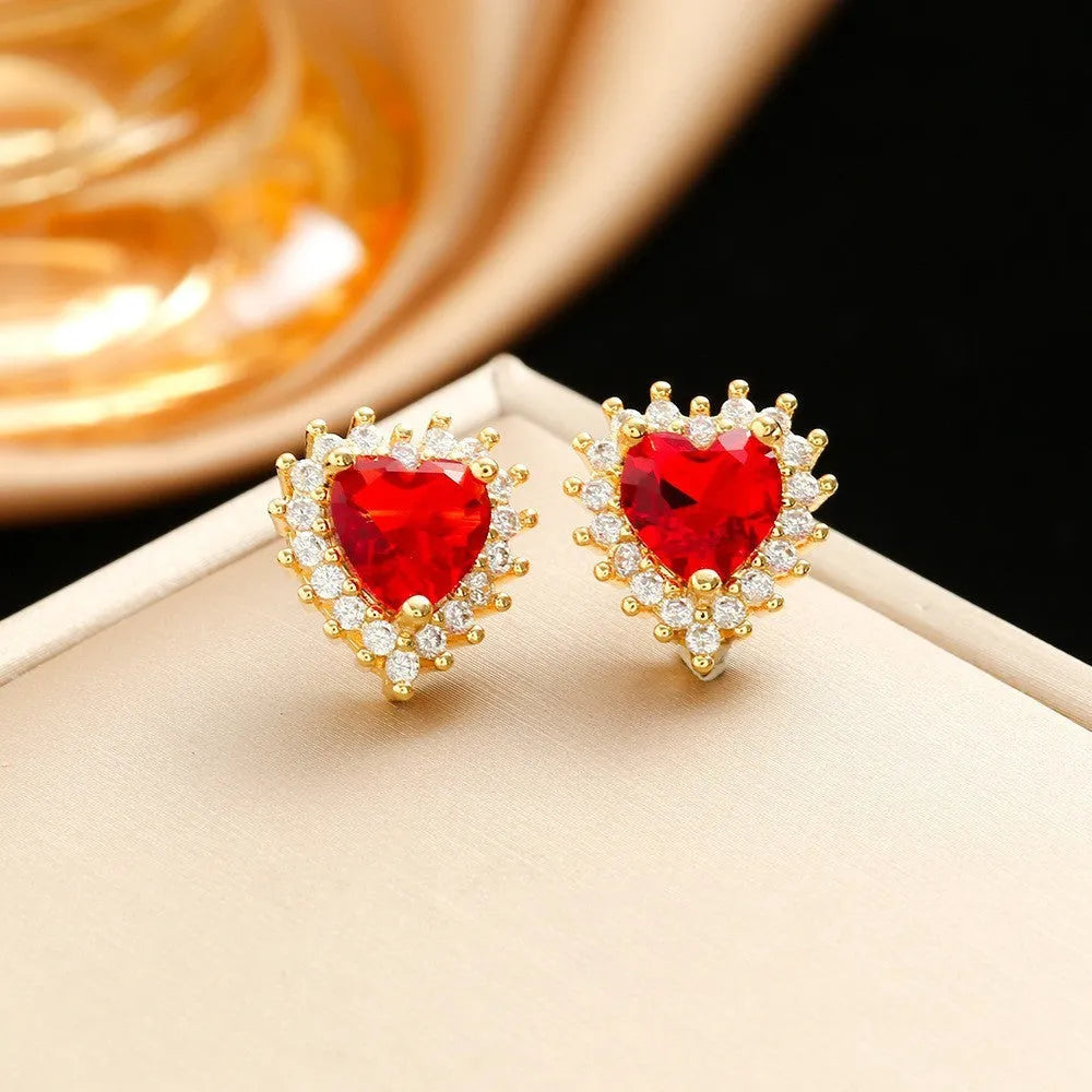 Gold red titanium steel jewellery set with heart flower pendant, matching earrings and ring