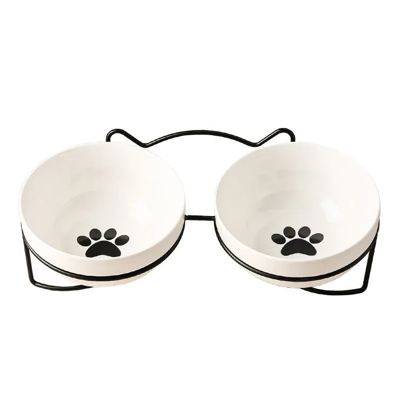 White ceramic pet bowl with decorative pattern in iron frame with cat ear accents