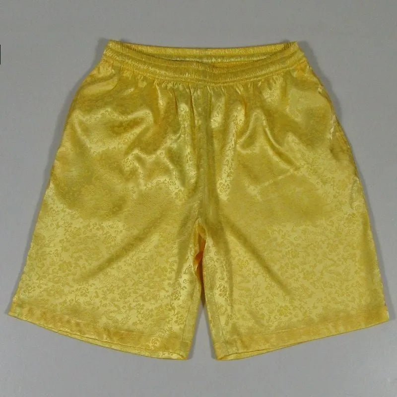 Men's black Tang Suit shorts with an elastic drawstring waistband, shown flat.