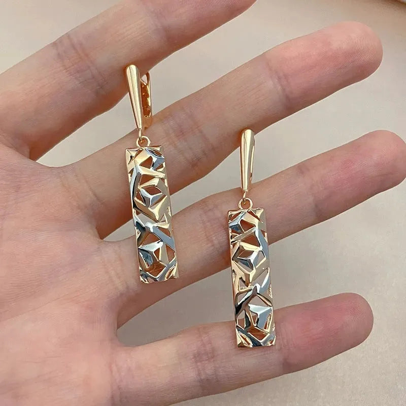 Two-tone rectangular hollow stud earrings for women, made from alloy with an electroplated finish.
