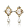 Gold alloy retro embossed geometric earrings on a surface