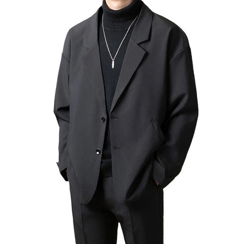 Loose fit light business suit jacket in chemical fibre blend fabric showing regular length and long sleeve design