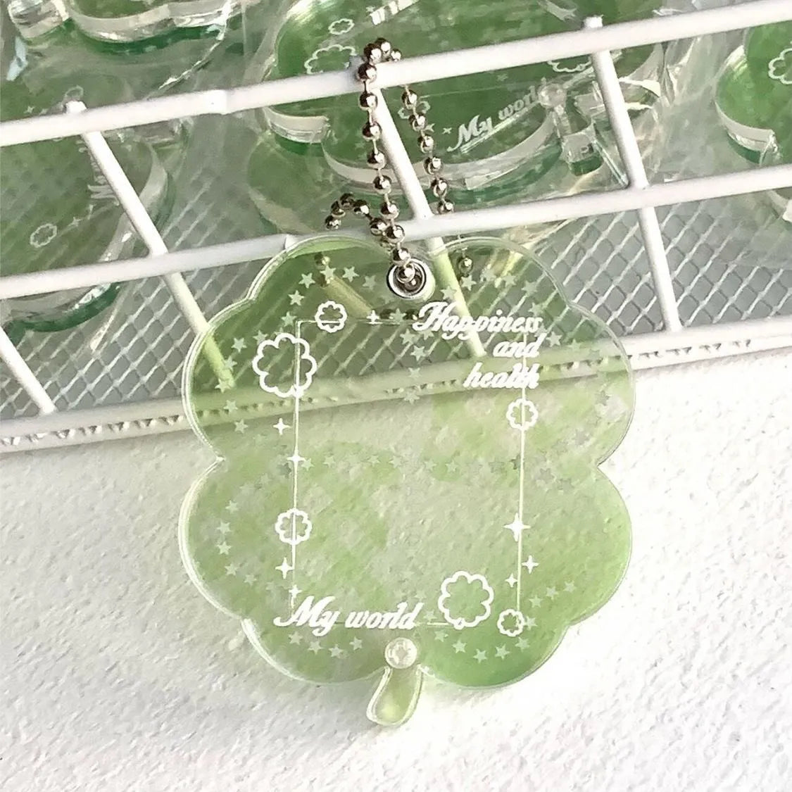 Acrylic four-leaf clover mobile phone pendant keychain in blue, green, and mint colours