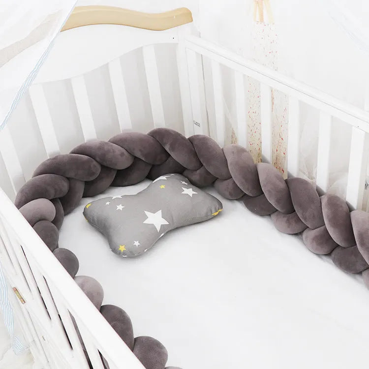 Braided knot crib bumper in spandex velvet, showing flexible length options for cot protection.