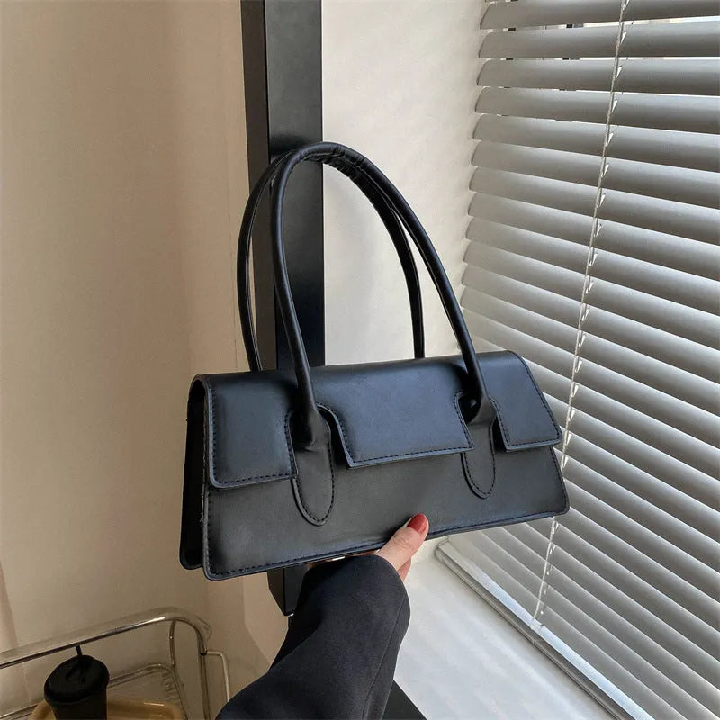 Women's black PU leather small square shoulder bag with stitching details and document compartment
