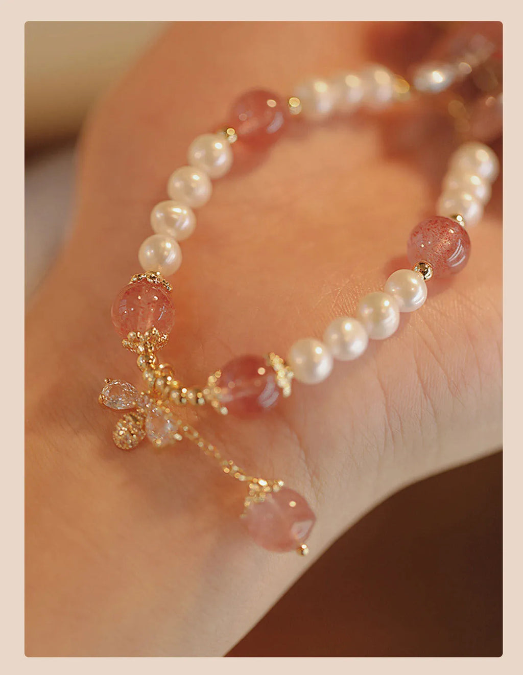 Women's crystal bracelet with strawberry quartz pearls and bow design