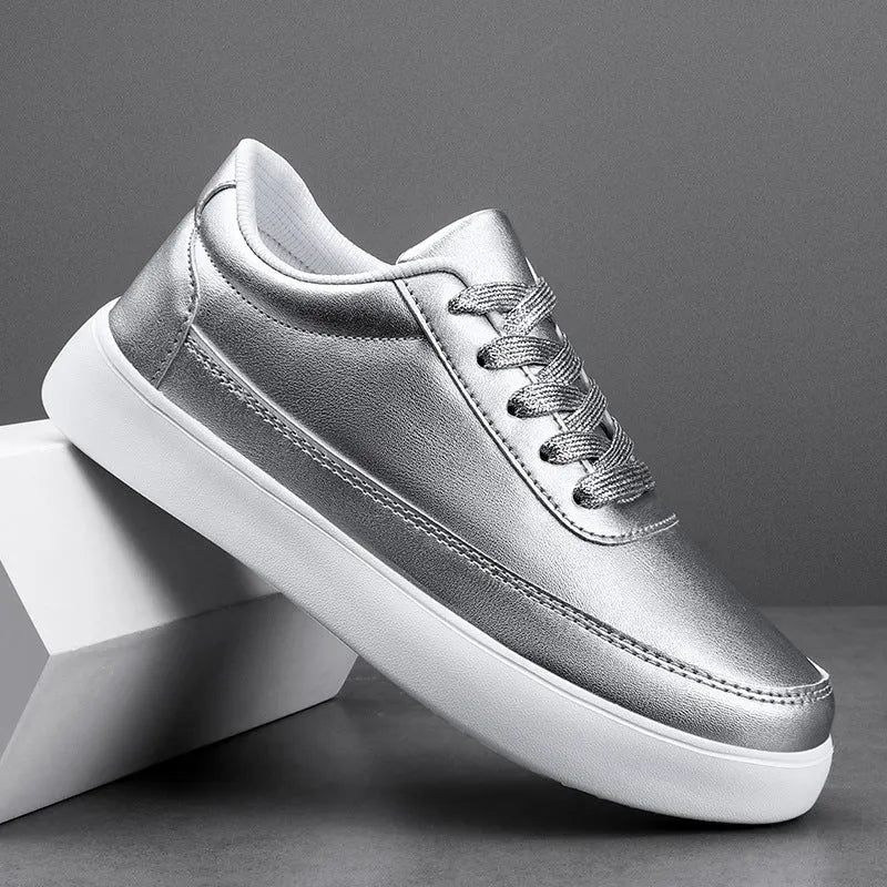 Women's white leather casual flat lace-up shoes on a neutral background.