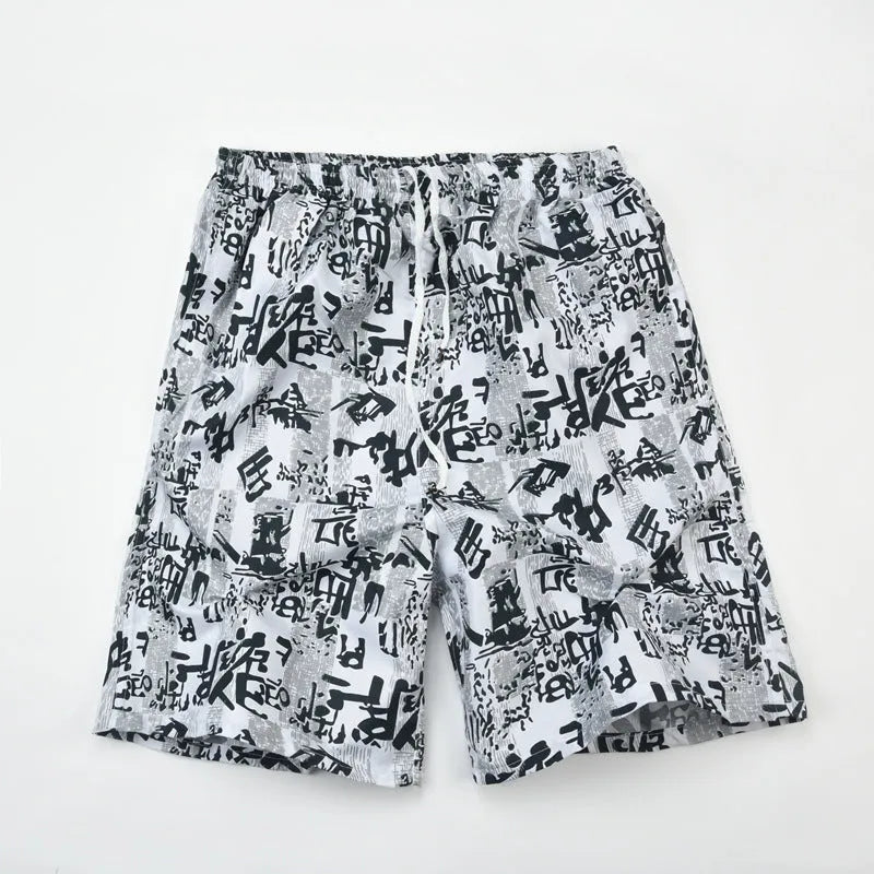 Men's casual floral print five-point swimming trunks made from polyester fabric.