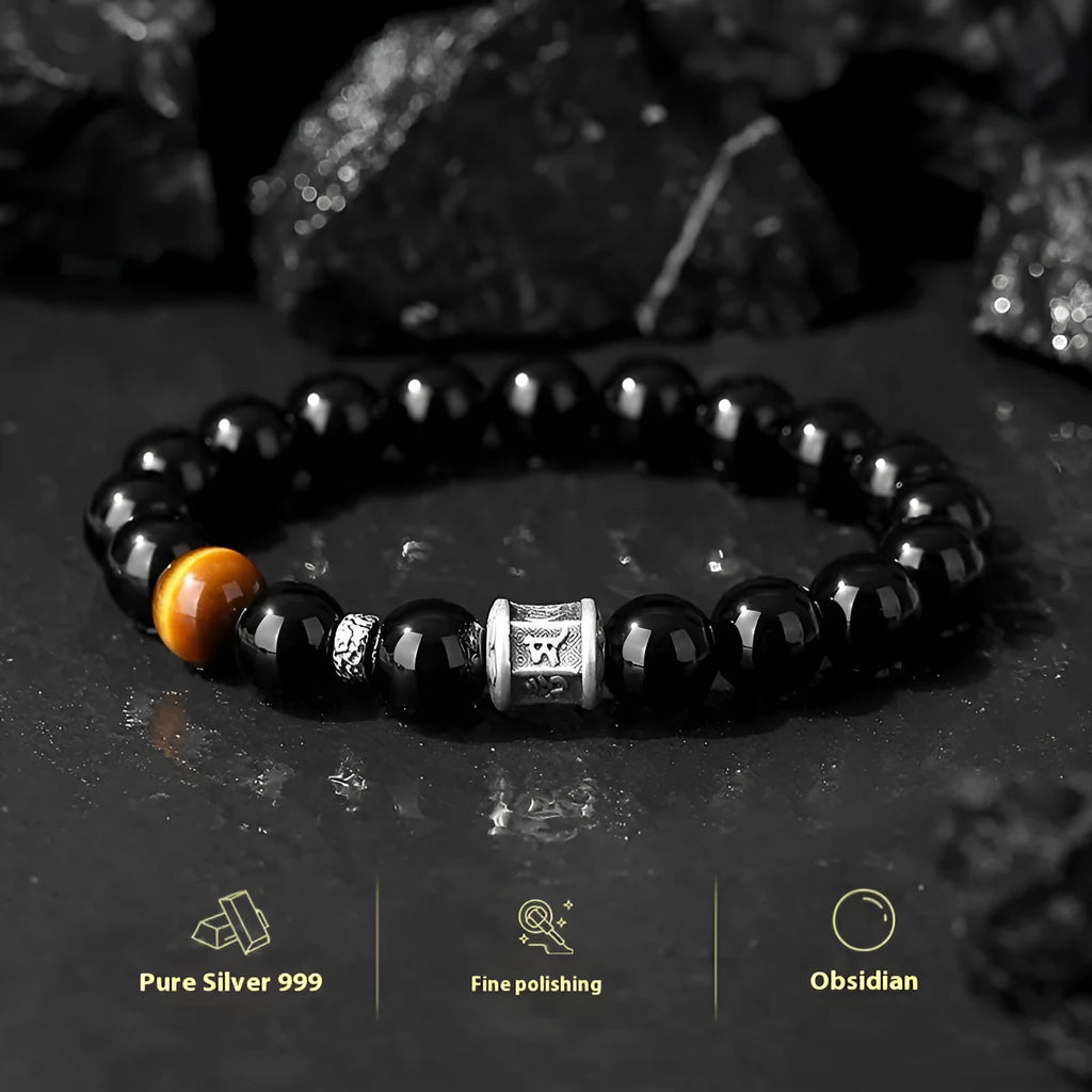 Men's obsidian prayer wheel bracelet with 10mm beads on wrist
