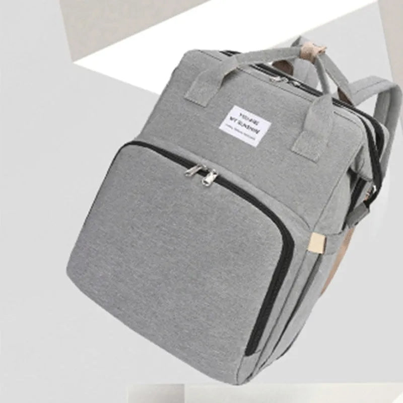 Portable folding mummy bag in multiple colours with curved shoulder strap and USB interface