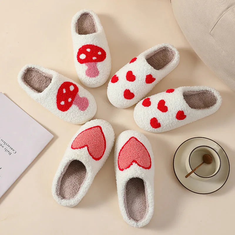Women's plush cartoon love style home slippers with a non-slip PVC sole.