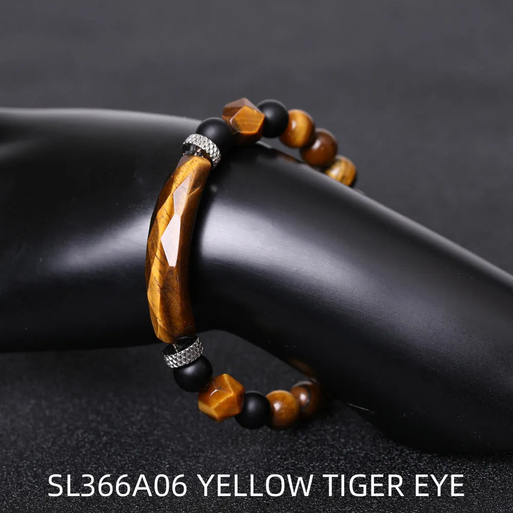 Handmade diamond-shaped cut agate bracelet in a geometric, fan-shaped design on a wrist.