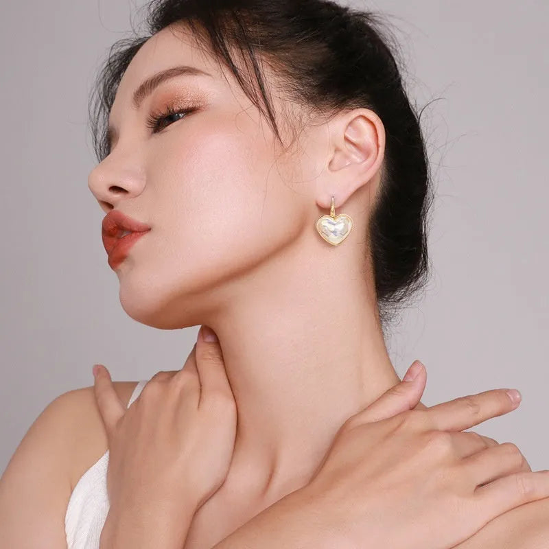 Gold summer love ear clips with alloy metal construction and clip-on design