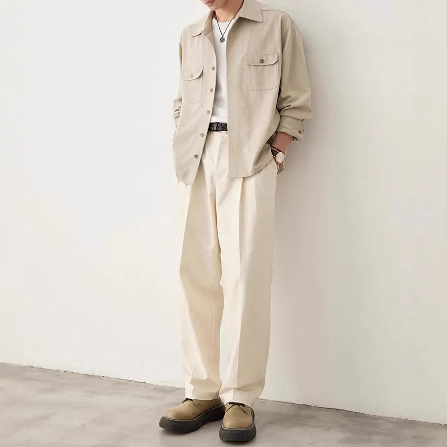 Men's simple profile lapel shirt in light sand rice colour, showing long sleeves and front button placket.