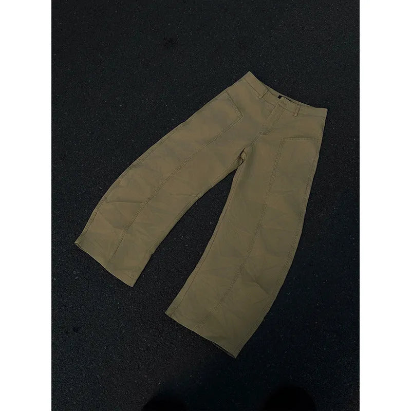 Men's khaki coloured straight-leg cotton casual trousers laid flat, showcasing the retro style and solid colour.