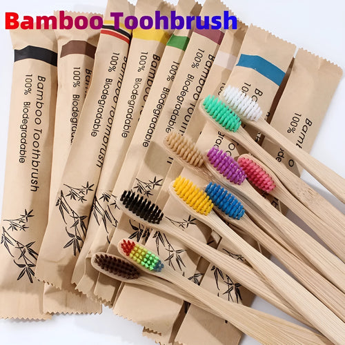 Set of ten bamboo toothbrushes with charcoal-infused bristles in assorted colours on a white background.