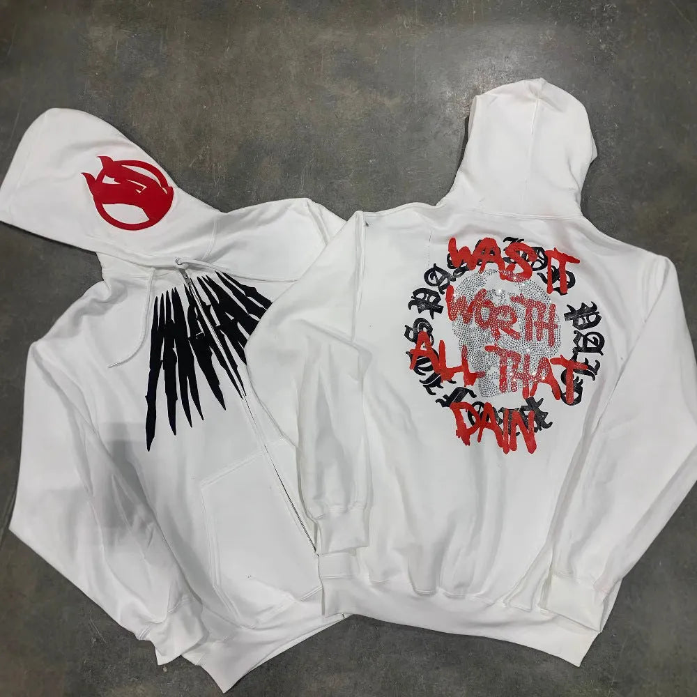 Black loose hooded sweatshirt with printed skull and rhinestone lettering on front