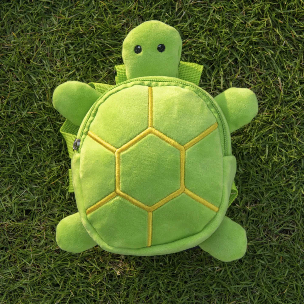 Turtle-shaped dog backpack harness in velvet with metal zipper, shown in available colours