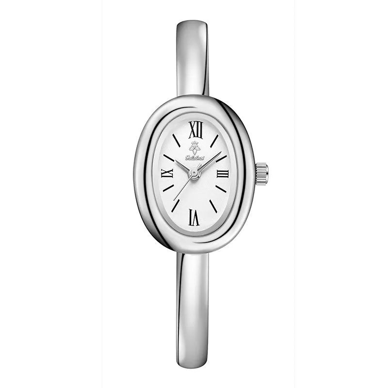 Women's slim oval retro quartz watch in gold colour on wrist
