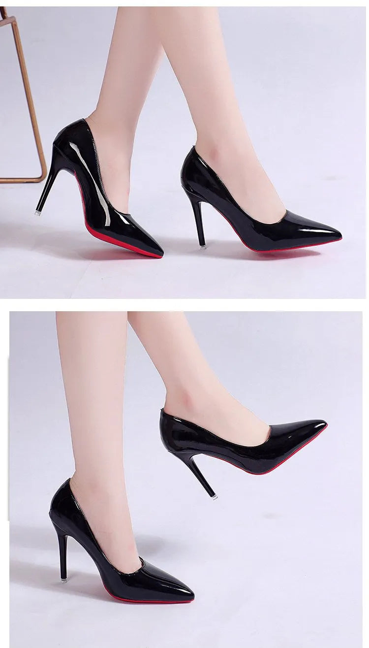 Women's black pointed toe stiletto pumps with a low-cut vamp and thin high heel on a white background.
