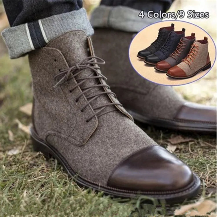 Men's black leather motorcycle-style ankle boots with belt buckle and rubber sole.