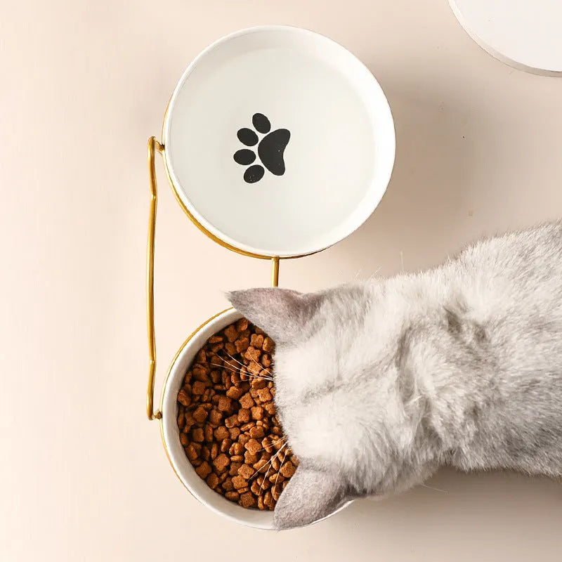 White ceramic pet bowl with decorative pattern in iron frame with cat ear accents