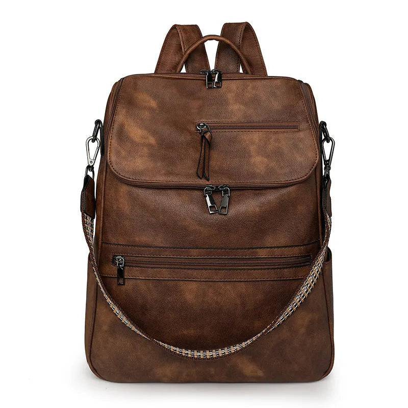 Solid colour retro college backpack with curved shoulder straps, shown in multiple colour options including black and blue.
