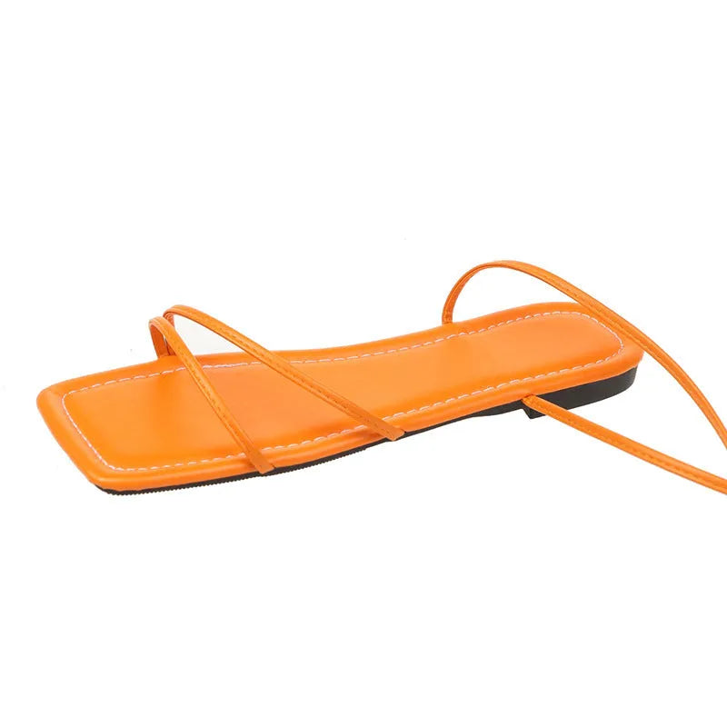 Women's flat sandals with ankle bandage strap in white, featuring a square toe and front lace-up.