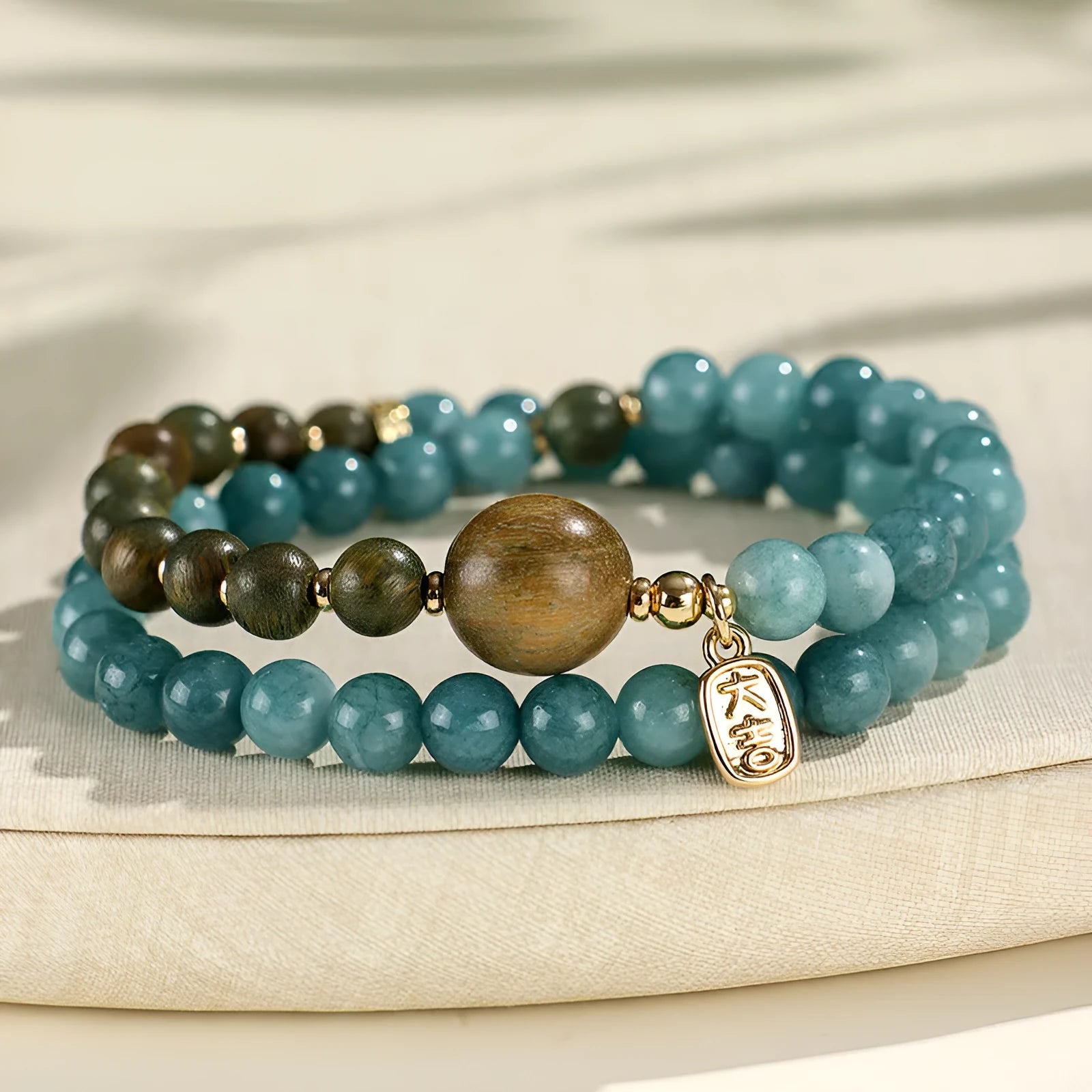 Natural stone blue gold sandalwood beaded bracelet for women with fu character and geometric design