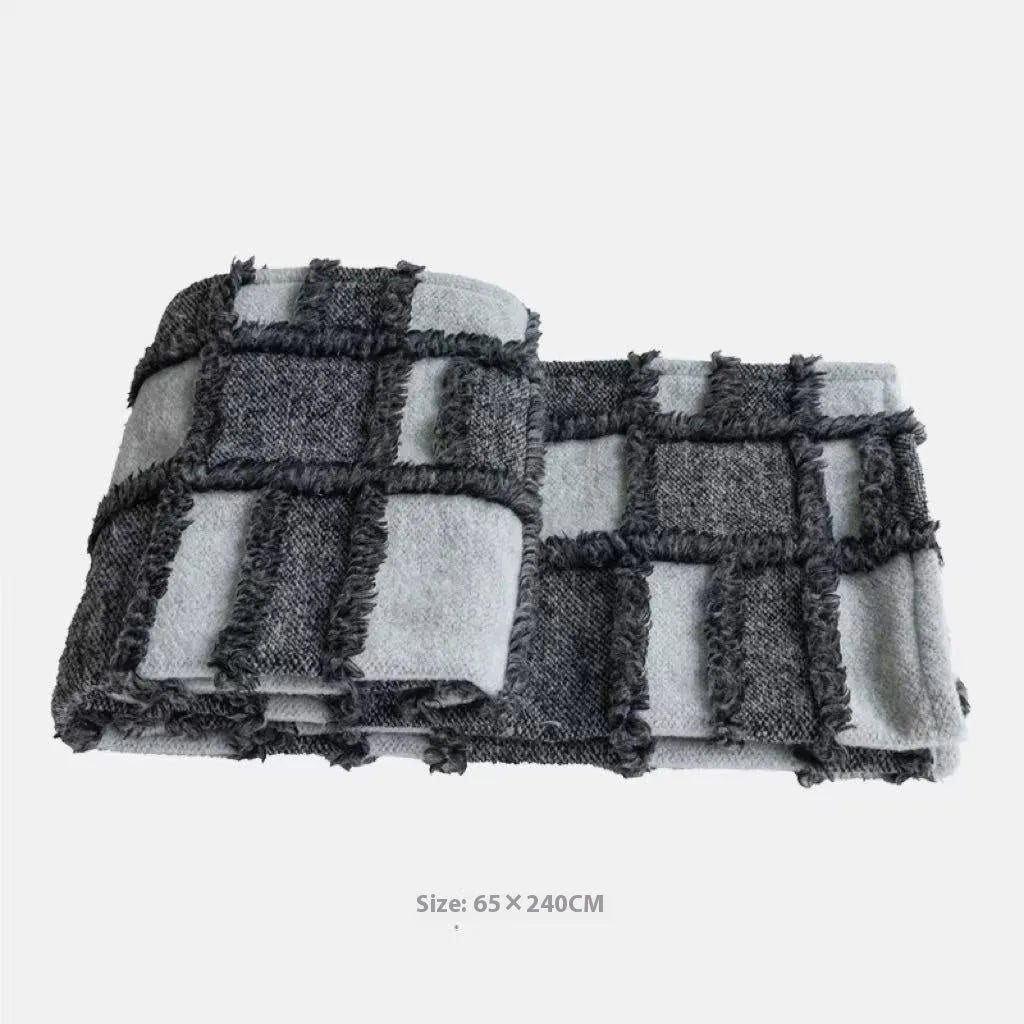 Polyester bed runner and nap blanket set with plaid pattern on bed with matching pillowcase and round pillow
