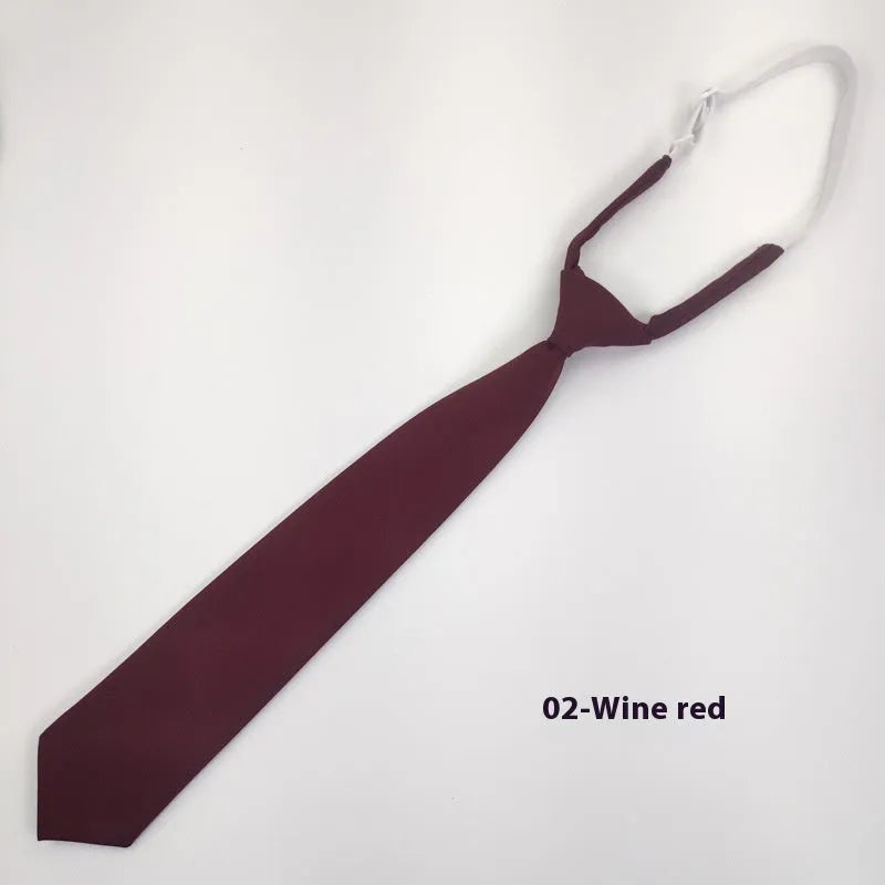 Solid navy blue men's cotton tie with arrow-type design on a white background.