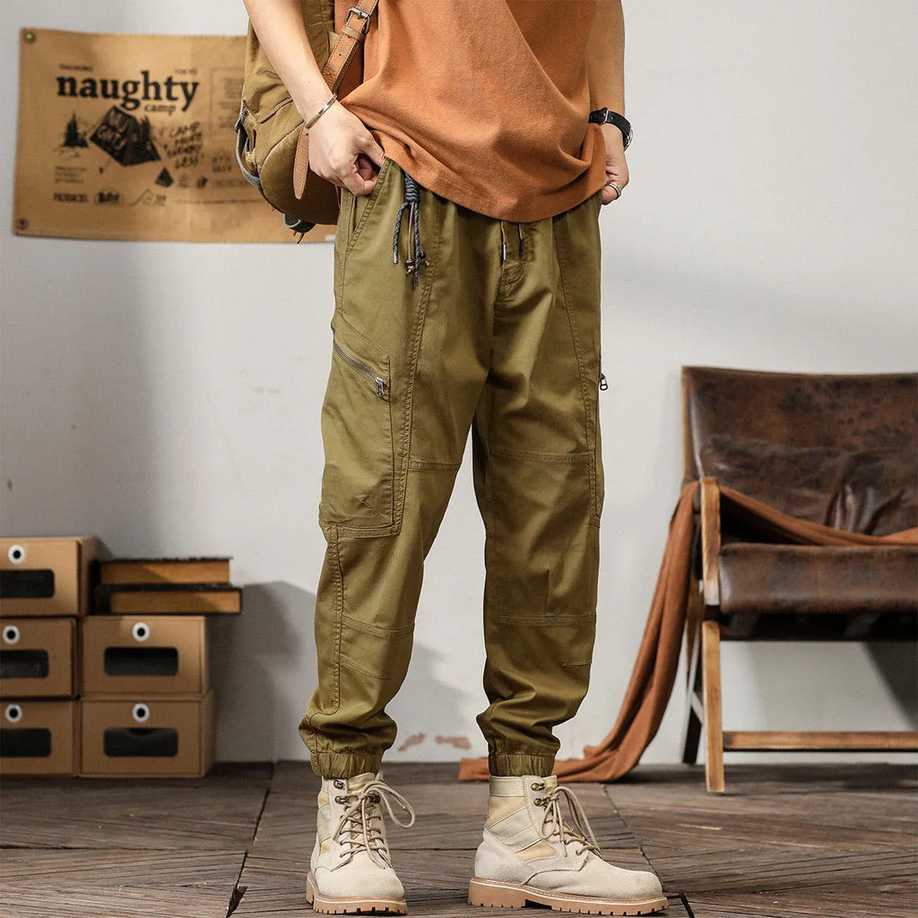 Men's cotton retro harem pants in tapered fit with ankle banding and zip fly