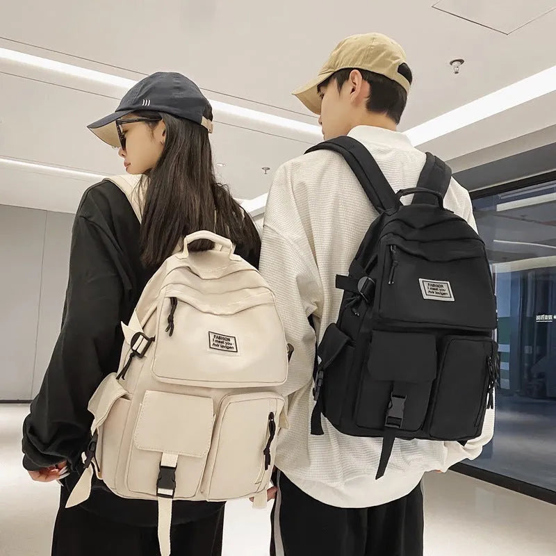 Black and white student backpack with computer compartment showing dimensions 31x12x41cm