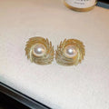 Women's vintage pearl earrings with irregular flower shape design