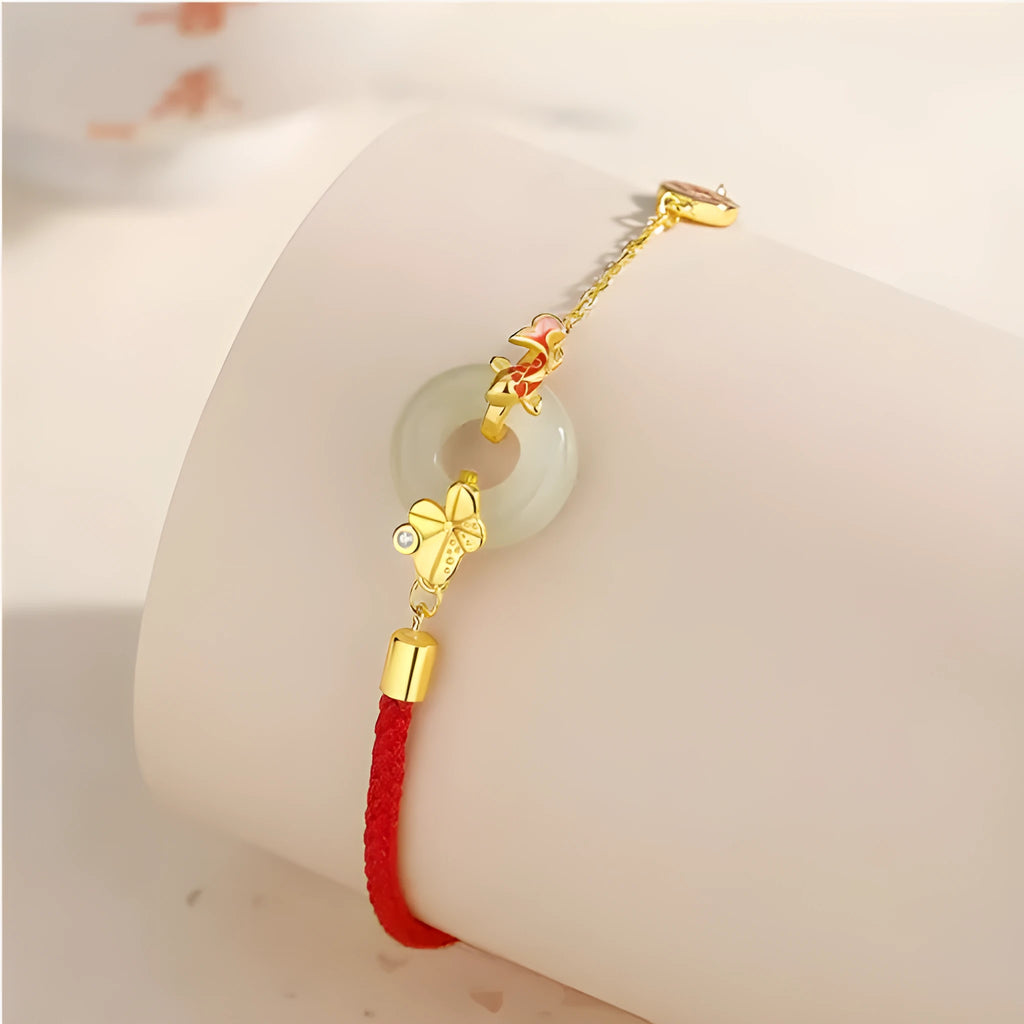Women's koi peace buckle bracelet in 925 silver with electroplated gold finish on red rope