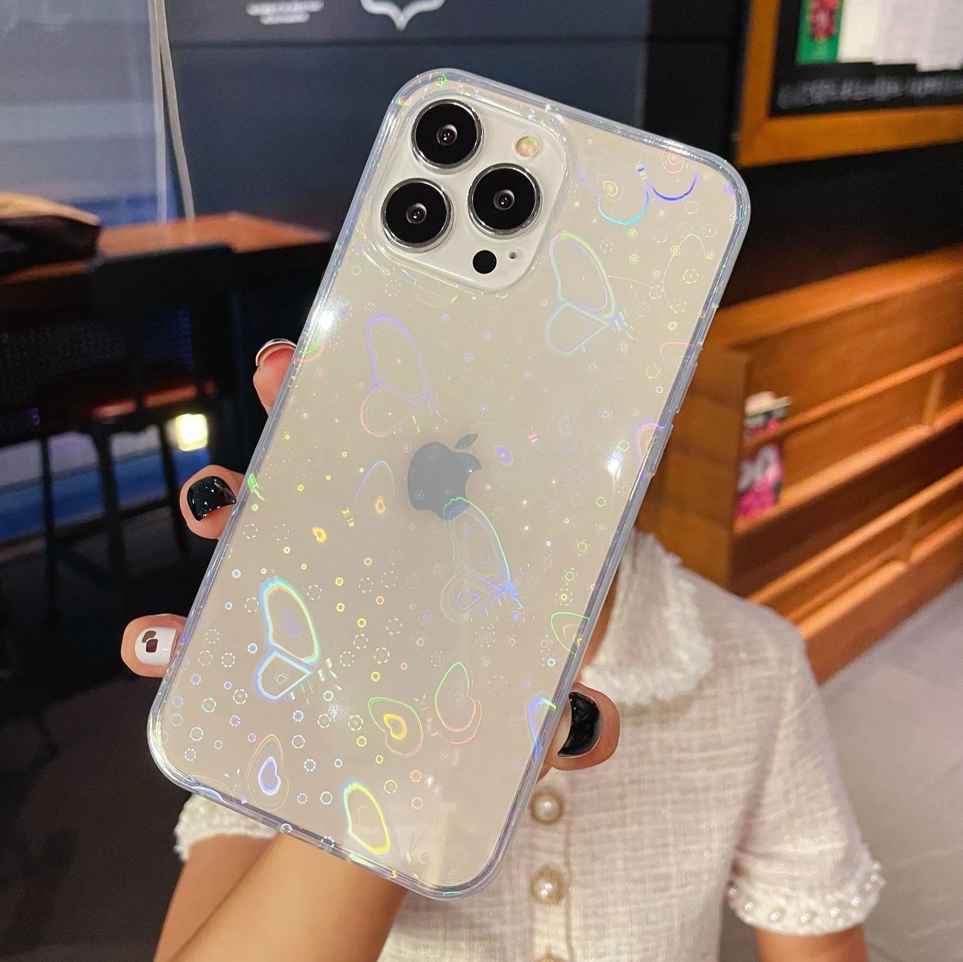 Transparent silicone iPhone case with laser-etched Love design on the back.