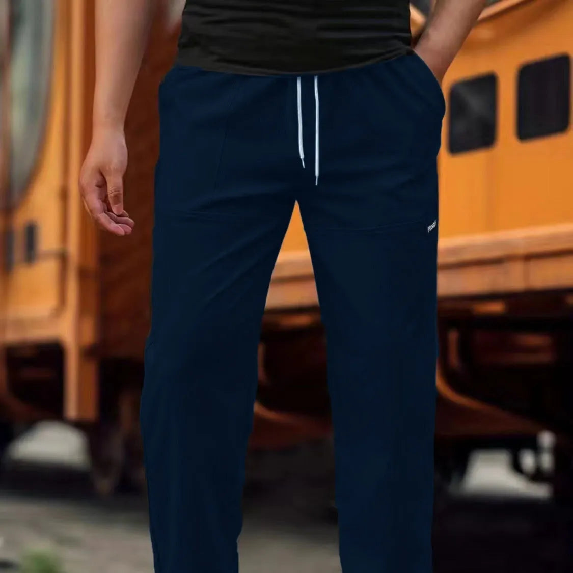 Men's casual polyester trousers for spring and autumn in light grey colour.