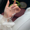 White sweet bow pearl necklace for women on an adjustable 31cm-40cm chain.